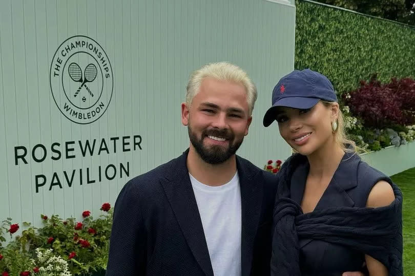 Olivia Attwood in a navy blue dress at Wimbledon alongside husband Bradley Dack, who has icy blond hair
