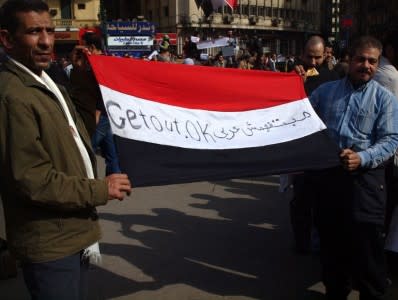 Flag_held_by_two_men_in_Cairo_protest_2011_Egyptian_Revolution