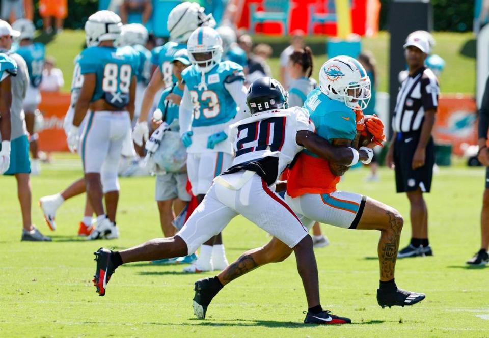 Atlanta Falcons cornerback Dee Alford (20) attempts to stop Miami Dolphins wide receiver Freddie Swain (88) during a joint practice at the Baptist Health Training Complex in Miami Gardens on Tuesday, August 8, 2023.