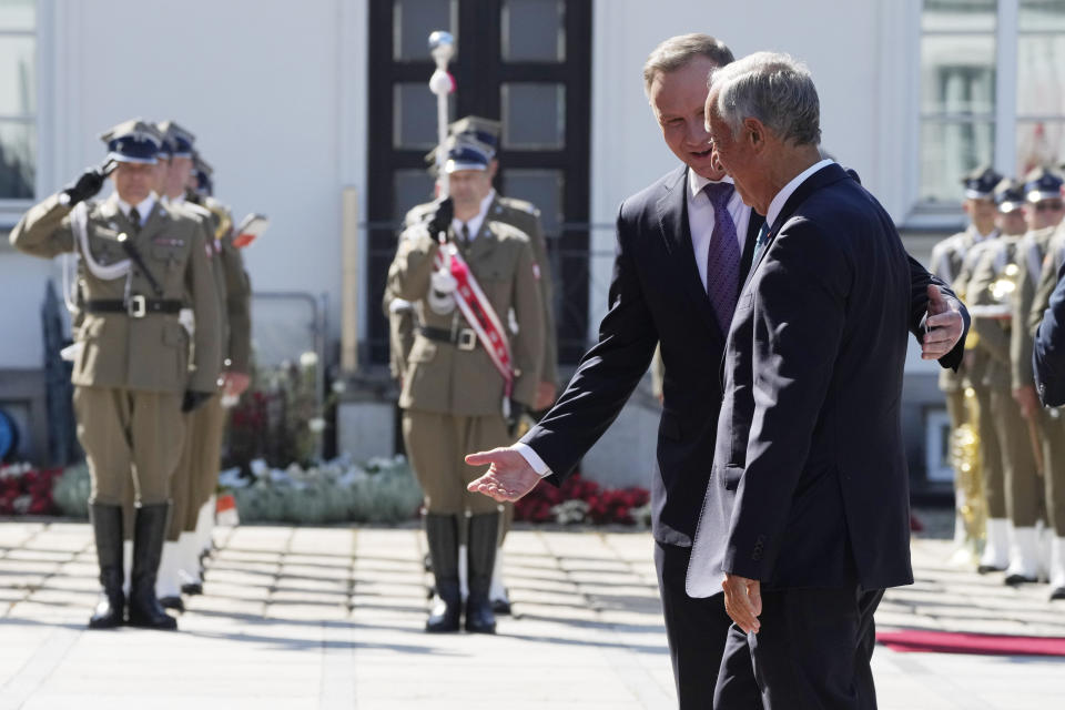 Poland's President Andrzej Duda, left, receives Portuguese President Marcelo Rebelo de Sousa during a state visit at the Belvedere Palace in Warsaw, Poland, Tuesday, Aug. 22, 2023. At a joint news conference de Sousa vowed continuing support for Ukraine's struggle against Russia's invasion, while Duda said Poland is watching Russia's transfer of some nuclear weapons into neighbouring Belarus. (AP Photo/Czarek Sokolowski)