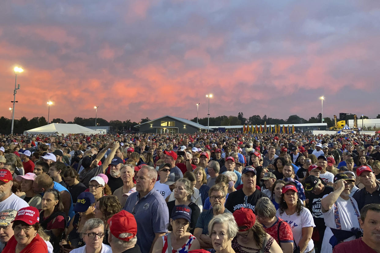 People gather ahead of an appearance by former President Donald Trump at a rally at the Iowa State Fairgrounds in Des Moines, Iowa., on Oct. 9, 2021. (AP Photo/Thomas Beaumont)