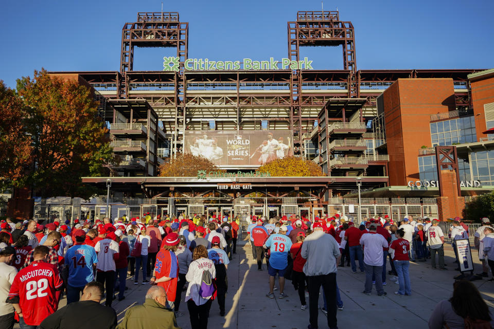 Fans arrive for Game 3 of baseball's World Series between the Houston Astros and the Philadelphia Phillies on Tuesday, Nov. 1, 2022, in Philadelphia. (AP Photo/Matt Rourke)