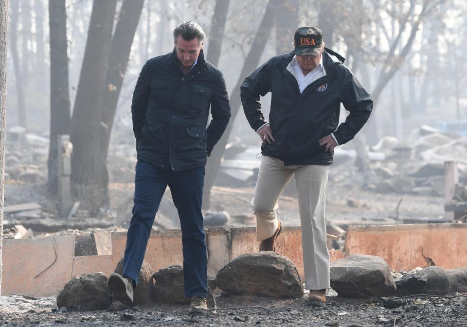 President Donald Trump and then-Lieutenant Gov. Gavin Newsom take a tour through Paradise 10 days after the fire started. (Photo: SAUL LOEB via Getty Images)