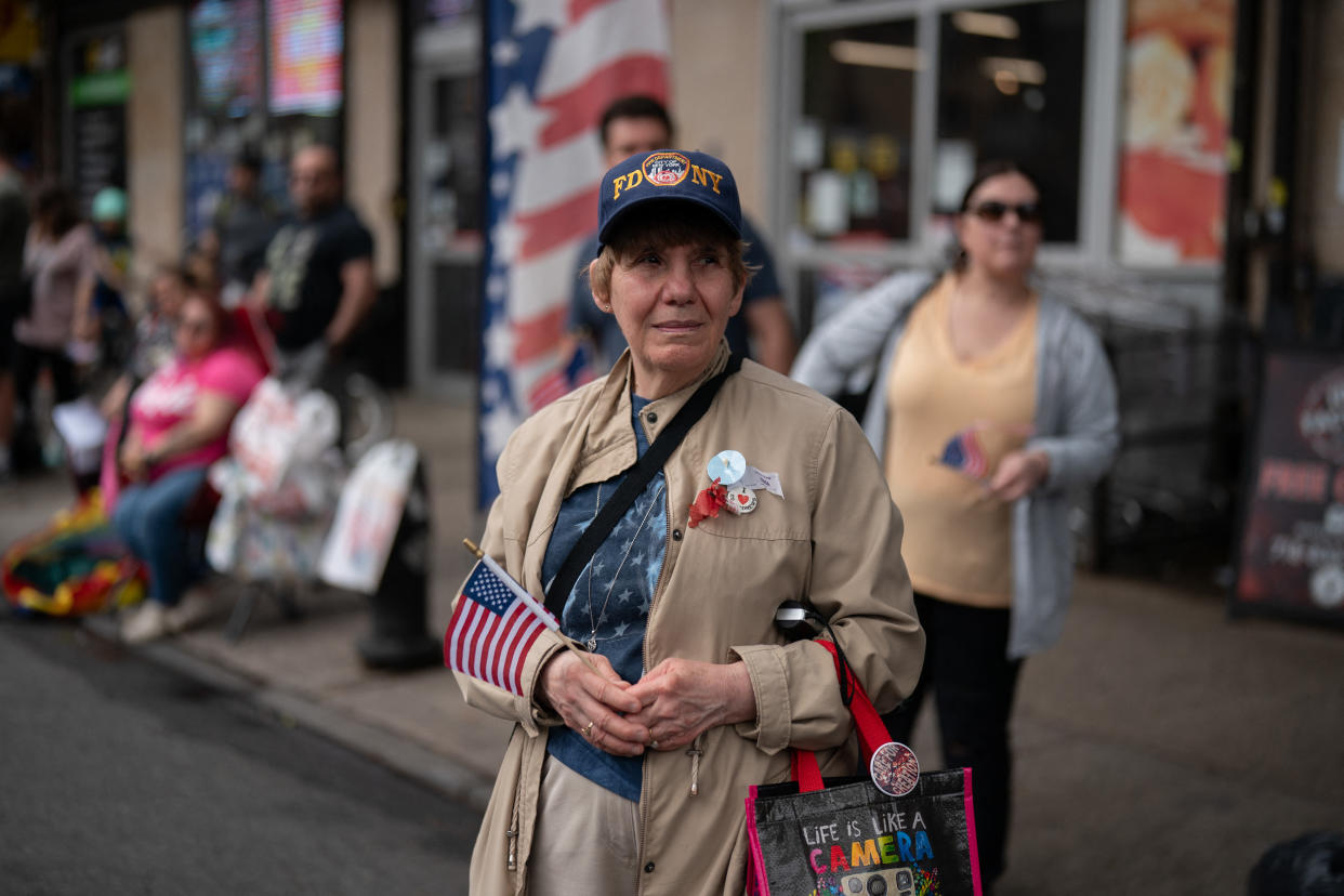 A woman holds an American flag while watching the 157th Brooklyn Memorial Day Parade in New York City on May 27, 2024. (Adam Gray/AFP) (Adam Gray/AFP via Getty Images)