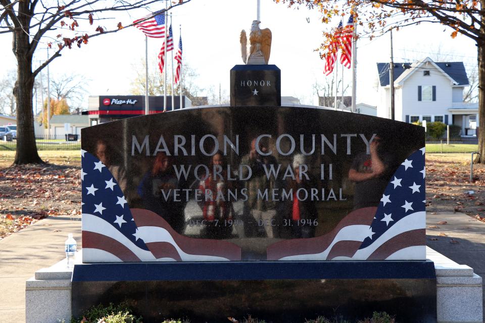 The gilded eagle on top of the World War II Memorial originally stood atop a wooden honor roll at the Marion County Courthouse. Behind it, on the Plaza of Heroes, are the names of more than 5,000 local service men and women who served from all of the branch of the military.