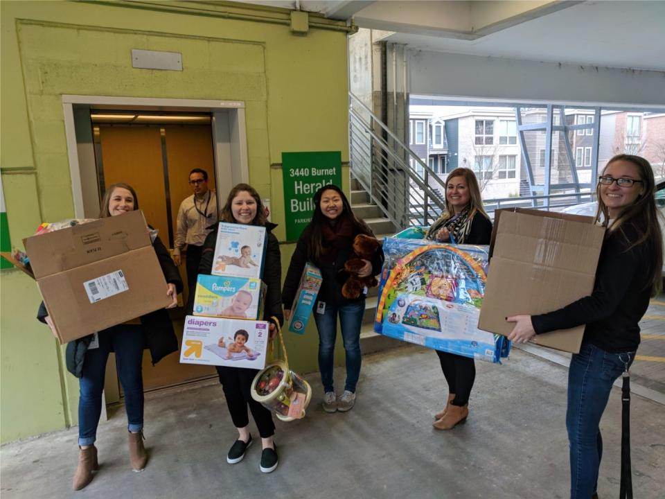 Myriad Neuroscience employees delivering toy drive donations at Cincinnati Children's Hospital Medical Center.