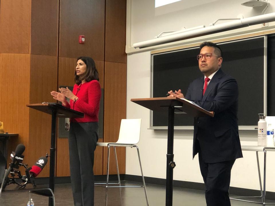 Mississauga mayoral candidates Dipika Damerla, left, and Alvin Tedjo, right, are pictured here at a debate on housing on Monday.