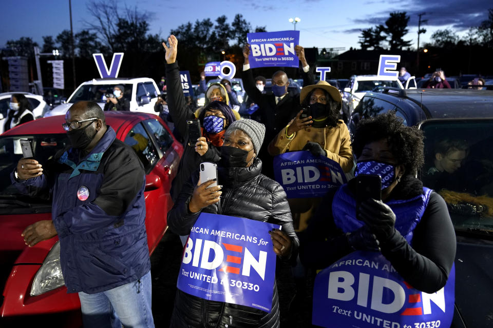 FILE - In this Nov. 2, 2020, file photo, supporters listen as Democratic presidential candidate former Vice President Joe Biden speaks at a drive-in campaign rally at Lexington Technology Park in Pittsburgh. A tough road lies ahead for Biden who will need to chart a path forward to unite a bitterly divided nation and address America’s fraught history of racism that manifested this year through the convergence of three national crises. (AP Photo/Andrew Harnik, File)