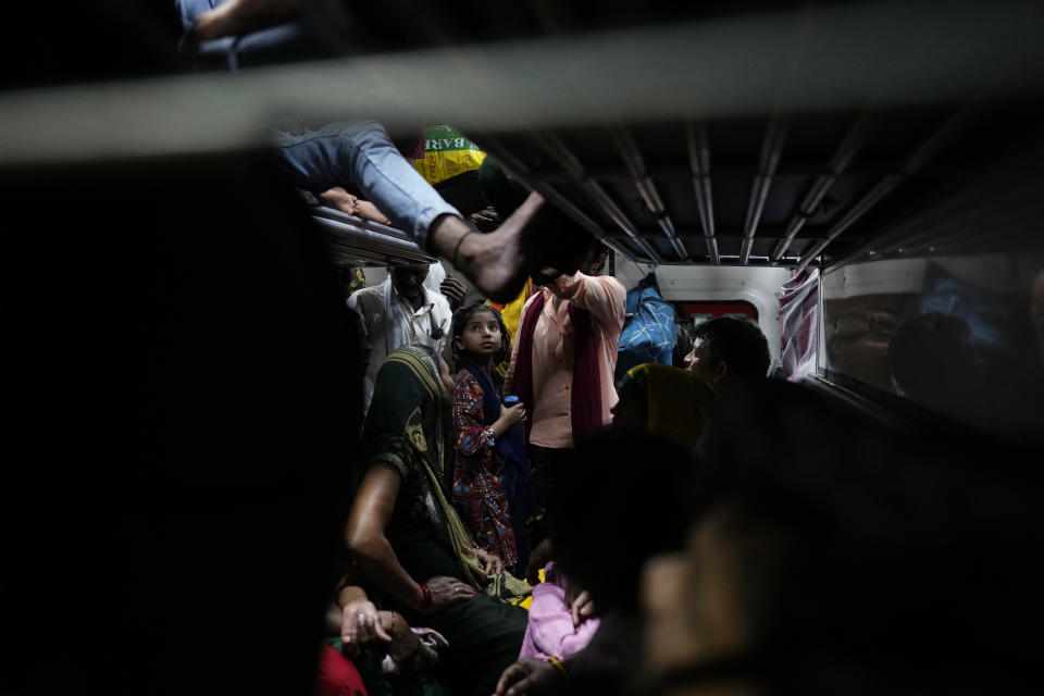 Passengers crowd a general class compartment of the Thirukkural Express at Nizamuddin railway station, in New Delhi, India, Saturday, April 20, 2024. (AP Photo/Manish Swarup)