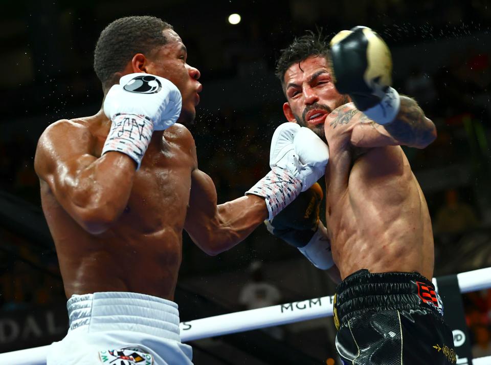 Devin Haney, left, punches Jorge Linares during the WBC lightweight title boxing match Saturday, May 29, 2021, in Las Vegas. (AP Photo/Chase Stevens)