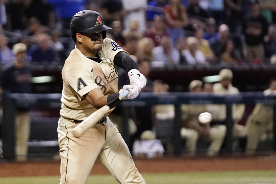 Arizona Diamondbacks' Gabriel Moreno connects for a game-winning single against the Chicago Cubs during the 13th inning of a baseball game Saturday, Sept. 16, 2023, in Phoenix. The Diamondbacks won 7-6 in extra innings. (AP Photo/Ross D. Franklin)