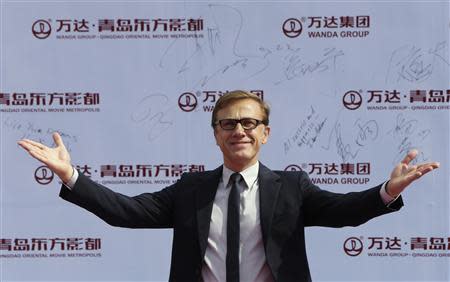 Austrian-German actor Christoph Waltz gestures to the media as he arrives for the launch ceremony of the Qingdao Oriental Movie Metropolis on the outskirts of Qingdao, Shandong province September 22, 2013. REUTERS/Jason Lee