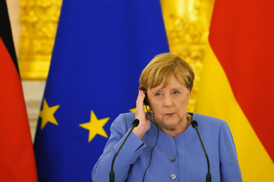 German Chancellor Angela Merkel attends a joint news conference with Russian President Vladimir Putin following their talks in the Kremlin in Moscow, Russia, Friday, Aug. 20, 2021. The talks between Merkel and Putin are expected to focus on Afghanistan, the Ukrainian crisis and the situation in Belarus among other issues. (AP Photo/Alexander Zemlianichenko, Pool)