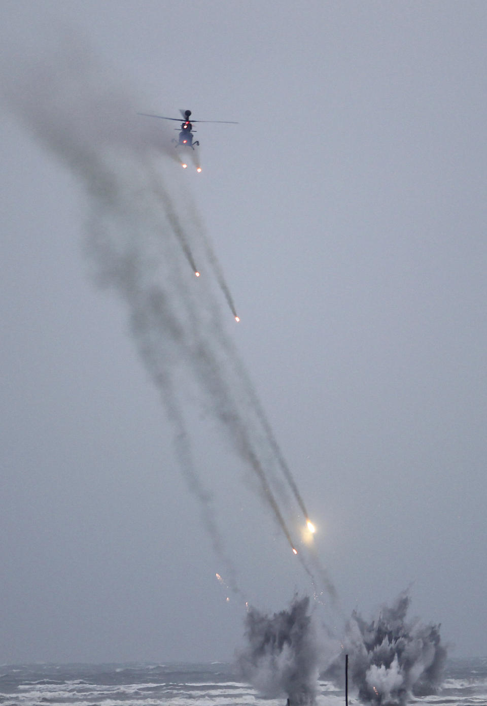 Taiwan's OH-58D Kiowa Warrior helicopter fires during a military exercises in Taichung, central Taiwan, Thursday, Jan. 17, 2019. Taiwan’s military has conducted a live-fire drill on Thursday to show its determination to defend itself from Chinese threats. (AP Photo/Chiang Ying-ying)