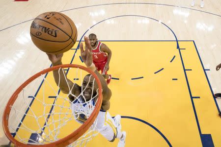 May 20, 2018; Oakland, CA, USA; Golden State Warriors forward Andre Iguodala (9) shoots the basketball against Houston Rockets guard Chris Paul (3) during the first half in game three of the Western conference finals of the 2018 NBA Playoffs at Oracle Arena. The Warriors defeated the Rockets 126-85. Mandatory Credit: Kyle Terada-USA TODAY Sports