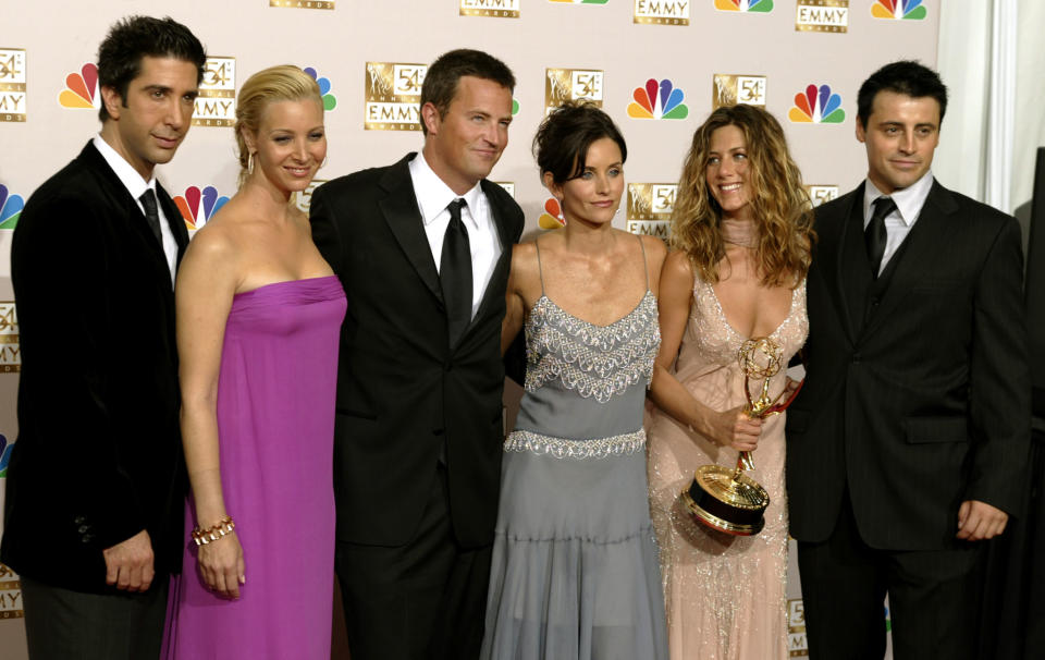 The cast of "Friends" appears in the photo room at the 54th annual Emmy  Awards in Los Angeles September 22, 2002. From the left are, David  Schwimmer, Lisa Kudrow, Matthew Perry, Courteney Cox Arquette, Jennifer  Aniston and Matt LeBlanc. Aniston won Outstanding Lead Actress in a  comedy series for her role on the show. REUTERS/Mike Blake    RG