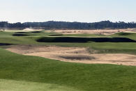 This Sept. 27, 2021 photo shows The Lido Golf Club under construction at Sand Valley Golf Resort in Nekoosa, Wis. The course was designed through old photos and documents, with the help of a course-building video game. The Lido will be an exact restoration of an abandoned course of the same name on Long Island, long considered one of the best golf courses in the world. (AP Photo/John Marshall)