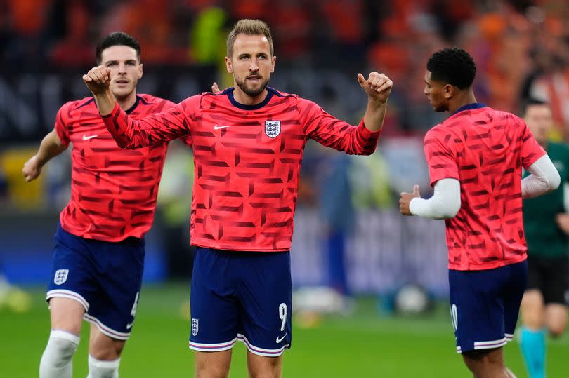 Harry Kane and other members of the England squad warm up at the BVB Stadion Dortmund in Dortmund