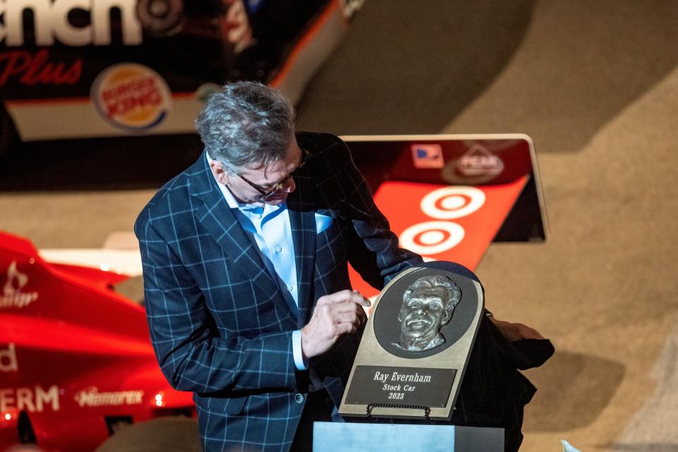 Ray Evernham looks at his plaque to be placed in the Motorsports Hall of Fame of America during a ceremony on Monday in Daytona Beach.