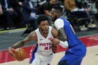 Detroit Pistons forward Saddiq Bey (41) is defended by Denver Nuggets forward JaMychal Green during the second half of an NBA basketball game, Friday, May 14, 2021, in Detroit. (AP Photo/Carlos Osorio)