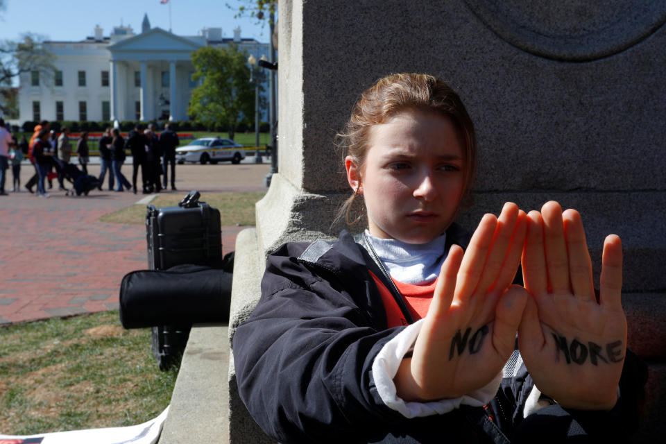 Emma Corcoran joins students observing 19 minutes of silence outside the White House.