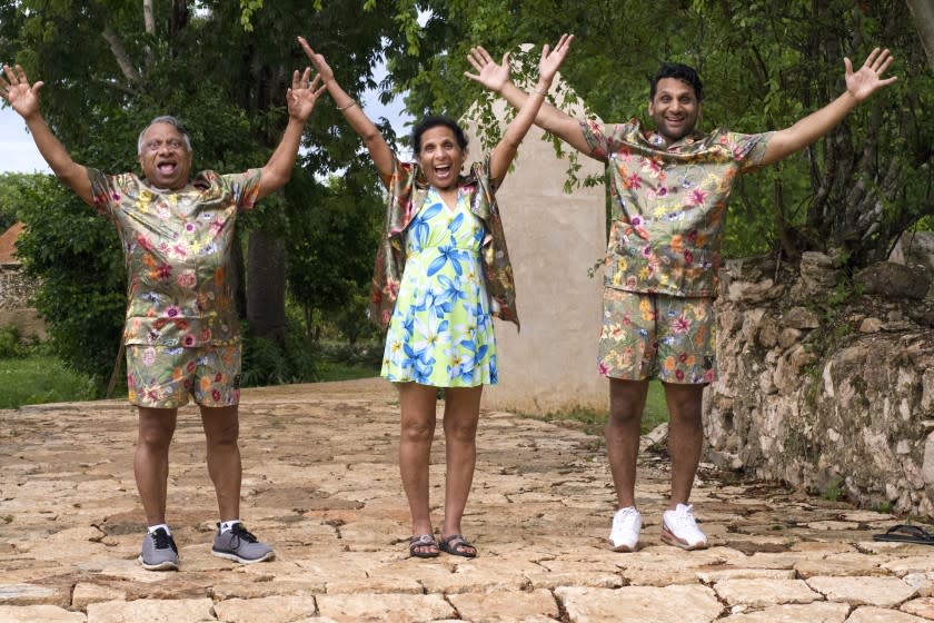 Ravi Patel and his parents Vasant and Champa pose in matching outfits in Mexico.
