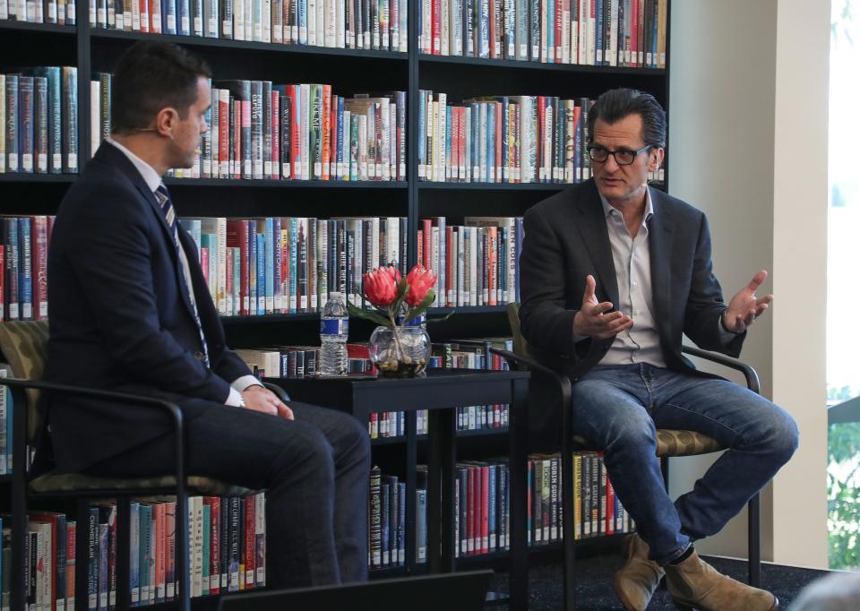 Ben Mankiewicz, right, speaks with Dave Karger during a discussion at the Rancho Mirage Writers Festival at the Rancho Mirage Public Library, February 1, 2023.  