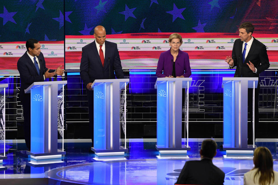 Democratic presidential hopeful former US Secretary of Housing and Urban Development Julian Castro (L) and Former US Representative for Texas' 16th congressional district Beto O'Rourke (R) address each other as US Senator from New Jersey Cory Booker and US Senator from Massachusetts Elizabeth Warren look on during the first Democratic primary debate of the 2020 presidential campaign season at the Adrienne Arsht Center for the Performing Arts in Miami, Florida, June 26, 2019. | Jim Watson—AFP/Getty Images