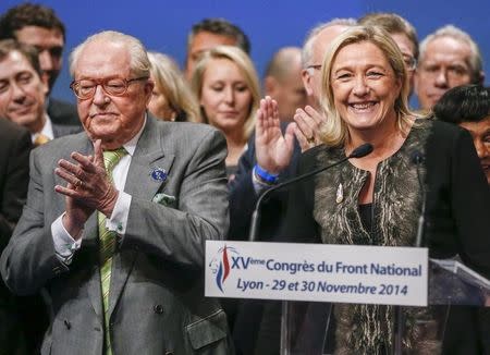 Marine Le Pen (R), France's National Front political party leader, and her father Jean-Marie Le Pen attend their party congress in Lyon in this November 30, 2014 file photo. REUTERS/Robert Pratta/Files