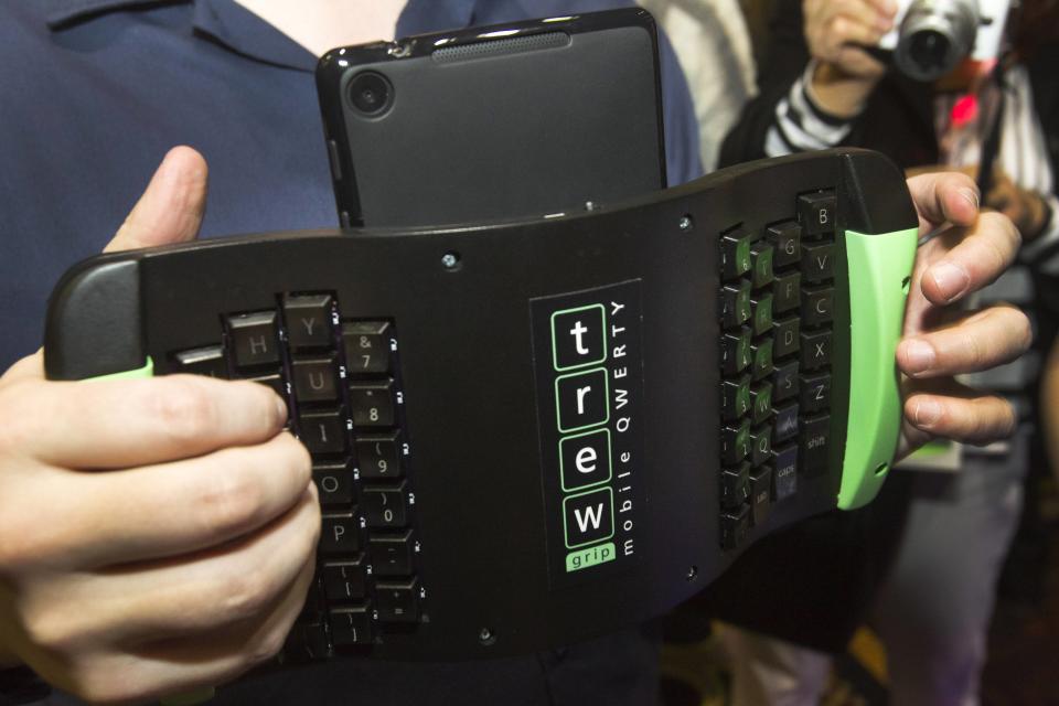 A TREWGrip keyboard is shown during "CES Unveiled," a media preview event to the annual Consumer Electronics Show (CES), in Las Vegas, Nevada, January 5, 2014. The keyboard keys face away from the user but allows people to type and enter data into a tablet while standing up. (REUTERS/Steve Marcus)