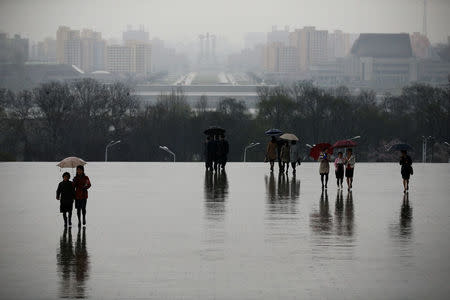 People arrive to pay respects at the statues of North Korea founder Kim Il Sung and late leader Kim Jong Il in Pyongyang, North Korea April 14, 2017. REUTERS/Damir Sagolj