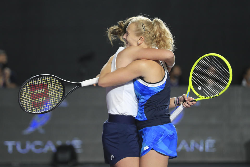 Barbora Krejcikova, left, and Katerina Siniakova, of the Czech Republic, celebrate after defeating Hsieh Su-wei, of Taiwan, and Elise Mertens, of Belgium, during the doubles final match of the WTA Finals tennis tournament in Guadalajara, Mexico, Wednesday, Nov. 17, 2021. (AP Photo/Refugio Ruiz)