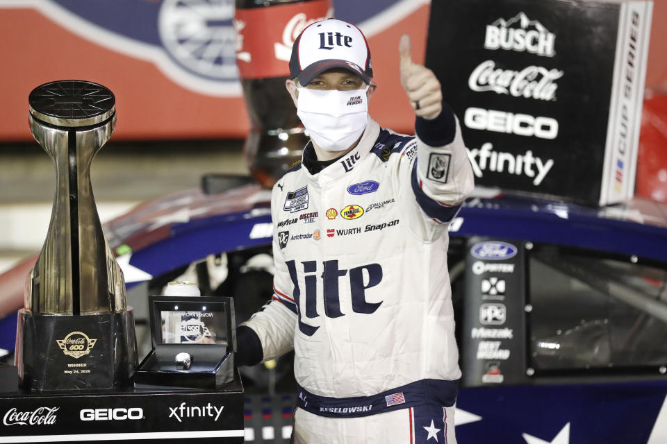 Brad Keselowski celebrates after winning the NASCAR Cup Series auto race at Charlotte Motor Speedway early Monday, May 25, 2020, in Concord, N.C. (AP Photo/Gerry Broome)