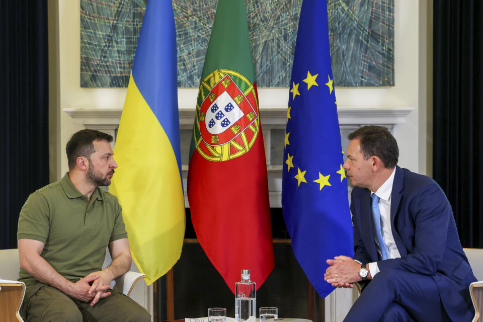 Ukrainian President Volodymyr Zelenskyy, left, meets with Portuguese Prime Minister Luis Montenegro at the Sao Bento Palace, the premier's official residence in Lisbon, Tuesday, May 28, 2024. (Antonio Cotrim, Pool Photo via AP)