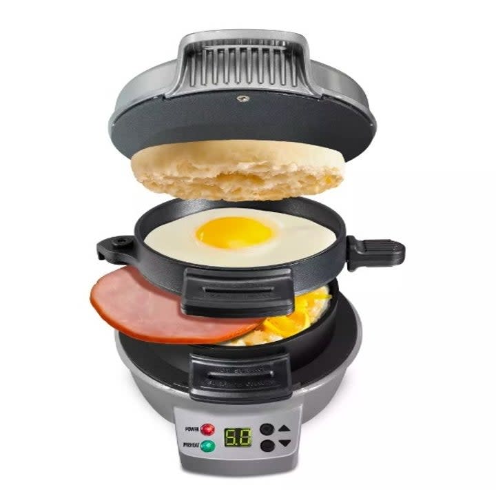 Sandwich maker with English muffin, eggs, ham and cheese