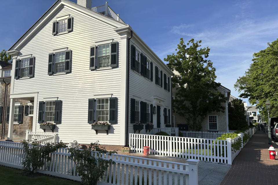 Brick sidewalks line homes in Edgartown, Mass., Tuesday, June 4, 2024. High housing costs on Martha's Vineyard are forcing many regular workers to leave and are threatening public safety. (AP Photo/Nick Perry)