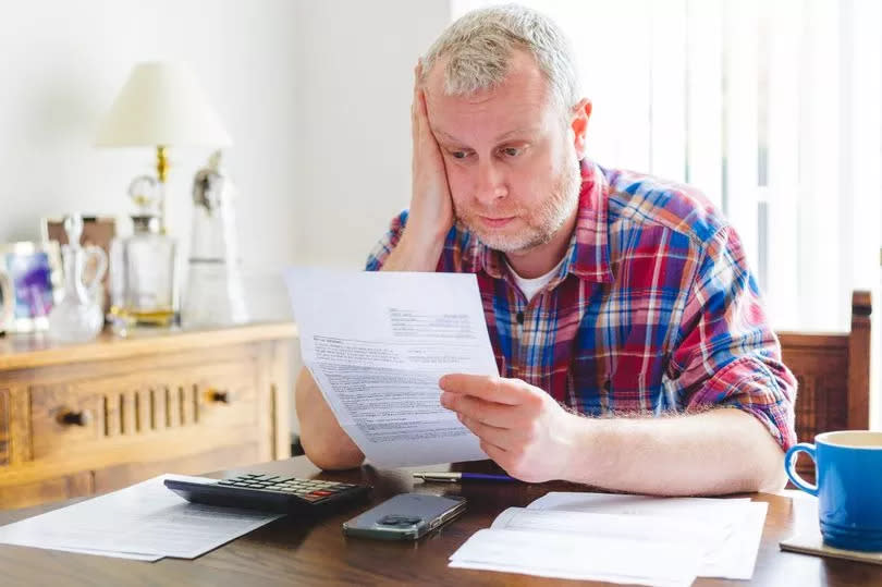 Man looking worried about a bill