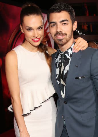 <p>Christopher Polk/Getty</p> Blanda Eggenschwiler and Joe Jonas in November 2013