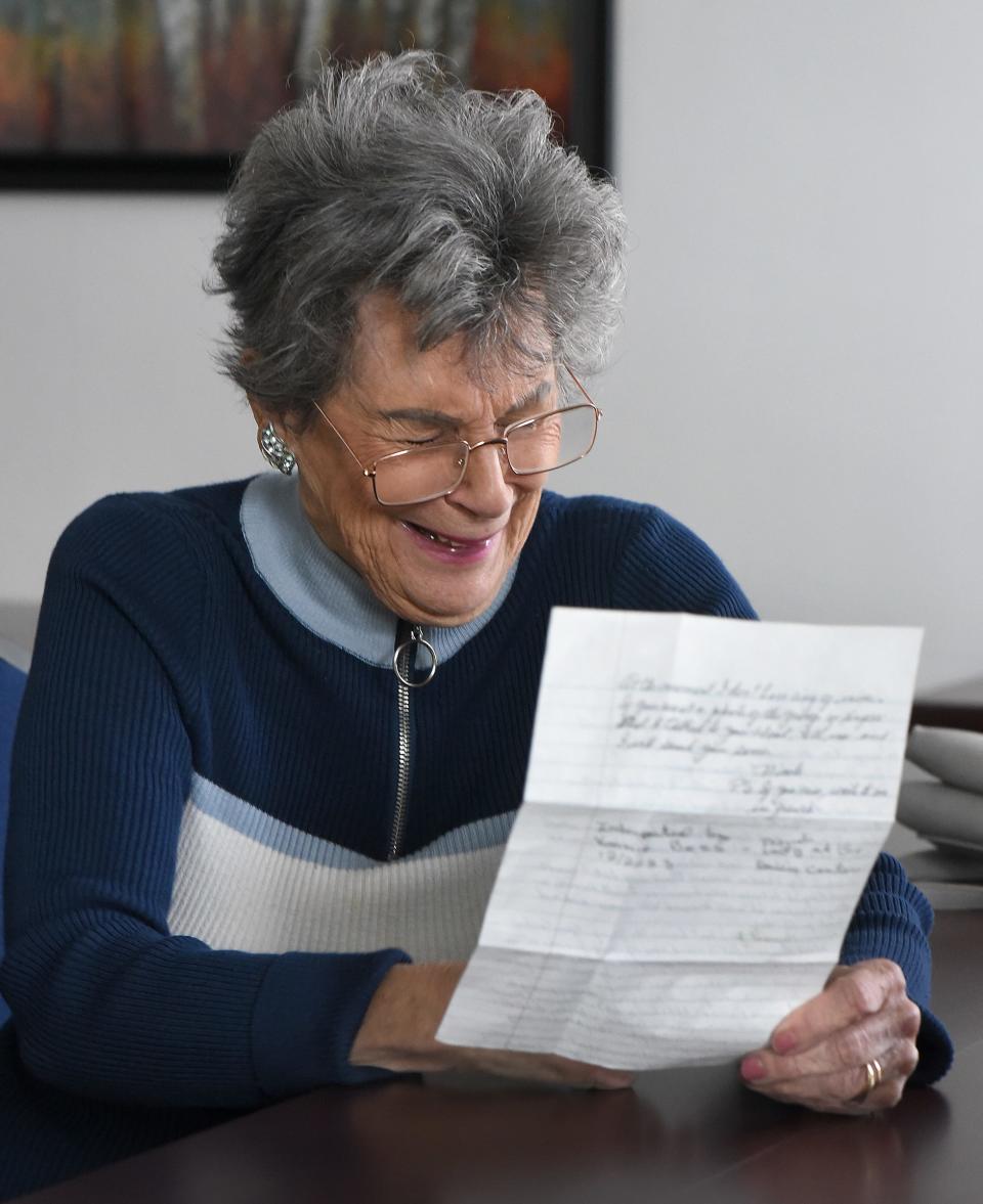 Vonnie Bess laughs while reading Bev Gerber's pen pal letter Wednesday at Monroe Center for Healthy Aging.