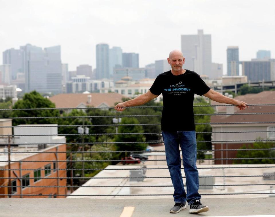 Former Fort Worth police officer Brian Franklin stands on top of a parking garage with the skyline in the background in Fort Worth, Texas, on June 23, 2023. Franklin spent 21 years in prison accused of a crime of which he was later acquitted. Now he is seeking compensation for his time served.