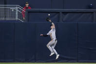 Colorado Rockies center fielder Brenton Doyle makes the catch at the wall for the out on San Diego Padres' Jurickson Profar during the second inning of a baseball game, Monday, May 13, 2024, in San Diego. (AP Photo/Gregory Bull)