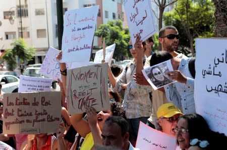 FILE PHOTO: Moroccan activists hold signs in solidarity with Hajar Raissouni, a journalist charged with fornication and abortion, during a protest outside the Rabat tribunal