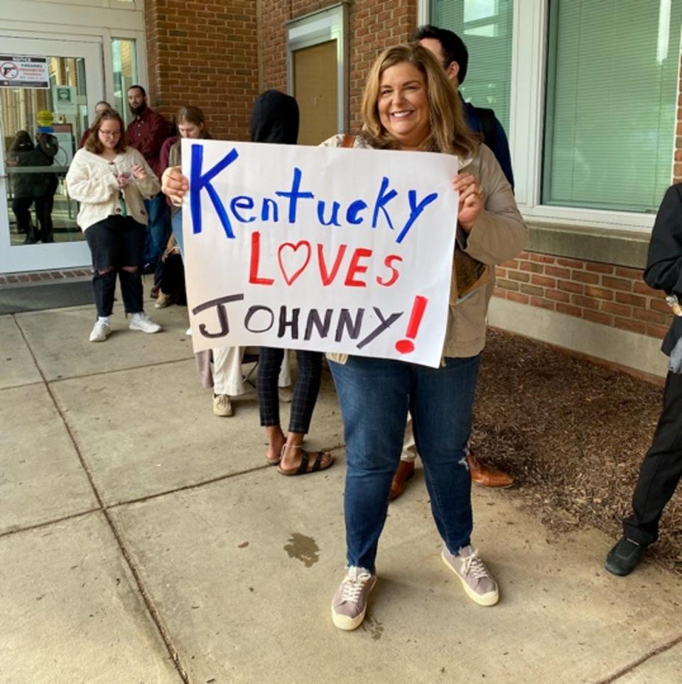 One fan holding a banner outside Fairfax County Courthouse in support of Johnny Depp (The Independent)