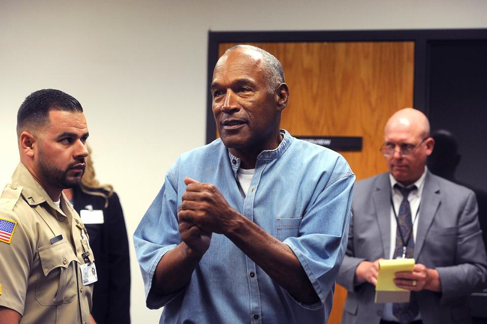 <p>O.J. Simpson (center) reacts during his parole hearing at Lovelock Correctional Centre in Lovelock, Nevada, U.S. July 20, 2017. REUTERS/Jason Bean/POOL </p>