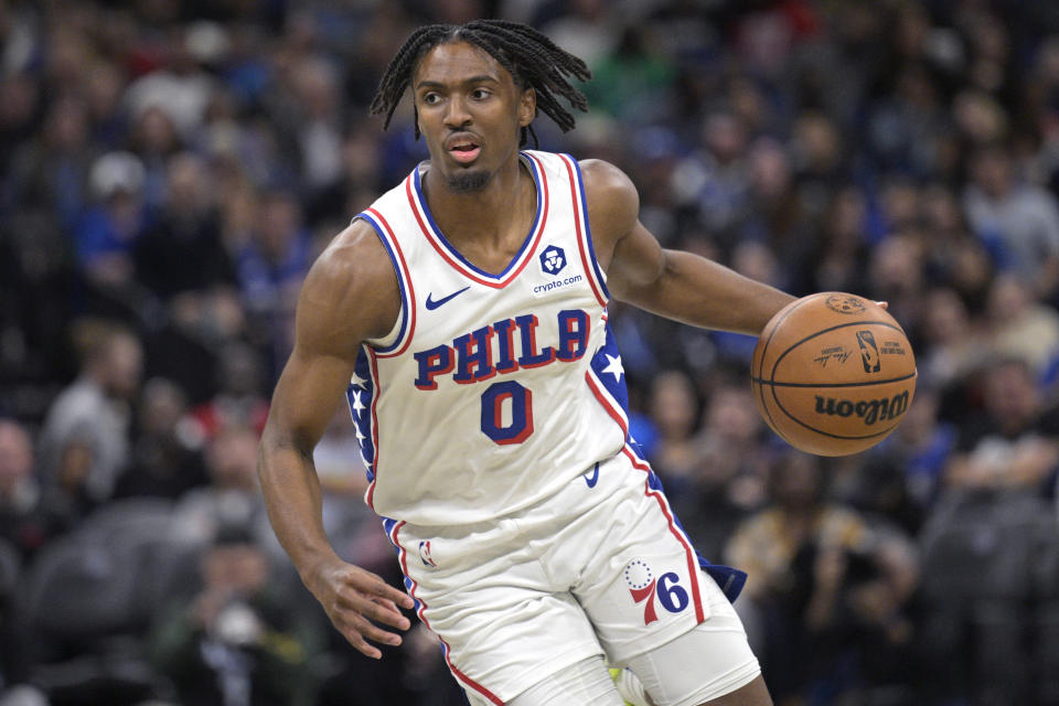 Philadelphia 76ers guard Tyrese Maxey (0) drives to the basket during the first half of an NBA basketball game against the Orlando Magic, Wednesday, Dec. 27, 2023, in Orlando, Fla. (AP Photo/Phelan M. Ebenhack)