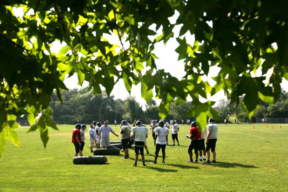 The Rogers High School football team practices at Murphy Field in Newport in 2010.