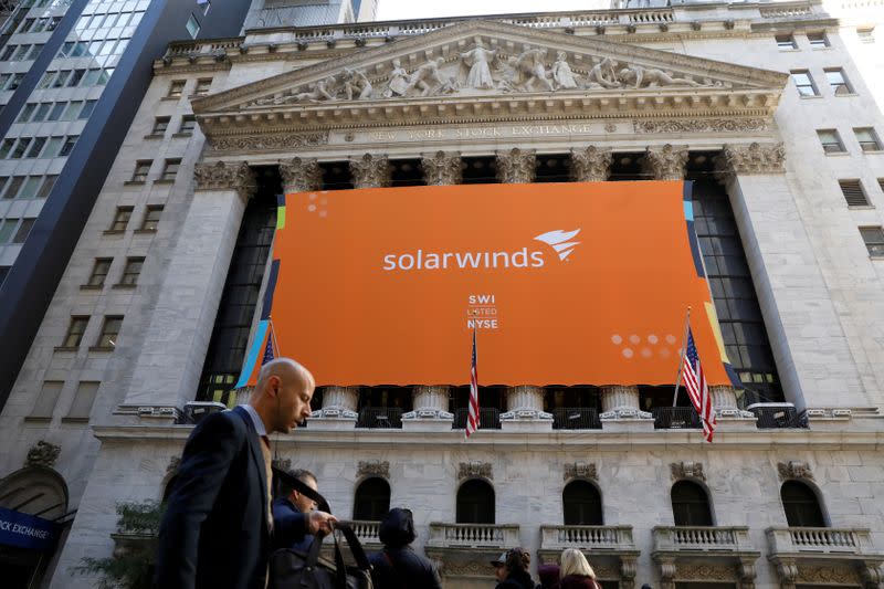 FILE PHOTO: SolarWinds Corp. banner hangs on the company's IPO at the NYSE in New York