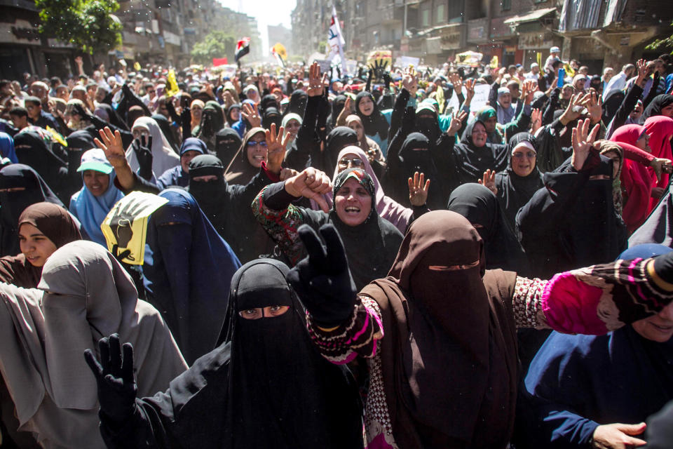 Supporters of the ousted Egypt's ousted President Mohamed Morsi march in Cairo, Egypt, Friday, March 28, 2014. Hundreds of Egyptian protesters took to the streets Friday, some clashing with security forces, to protest the decision by former military chief Abdel-Fattah el-Sissi to run in upcoming presidential elections. (AP Photo/Amru Taha)