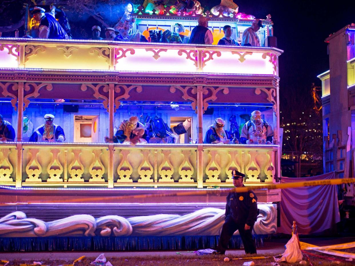 A police officer works the scene where a man was reportedly hit and killed by a float of the Krewe of Endymion parade in the runup to Mardi Gras: AP