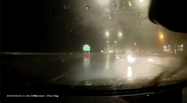 The car spins 180 degrees and ends up travelling backwards on the motorway. Source: Dash Cam Owners Australia/ Facebook